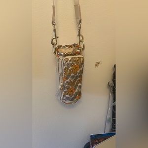 Water bottle holder. Crossbody or shoulder bag.
